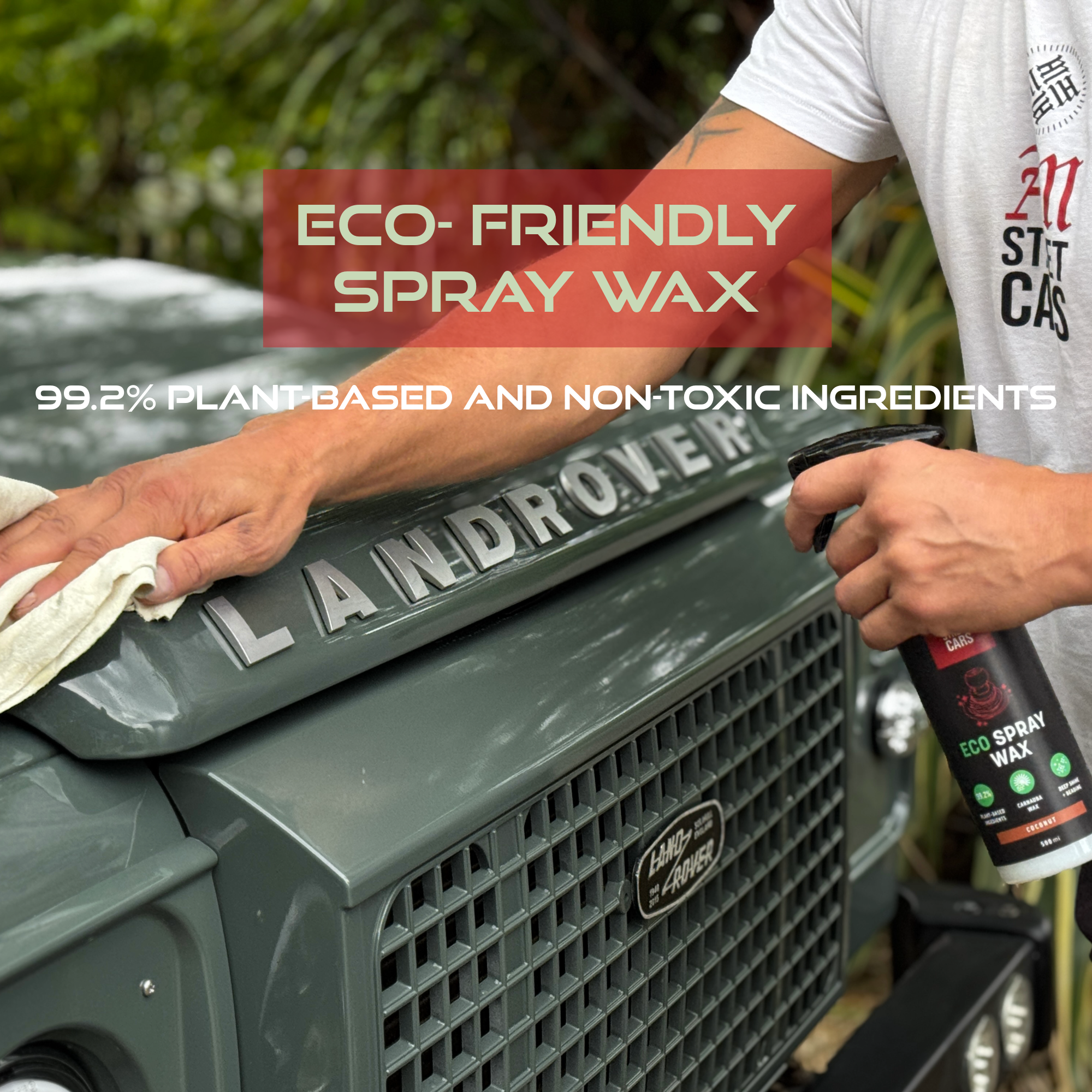 Person using eco-friendly spray wax on a Land Rover vehicle